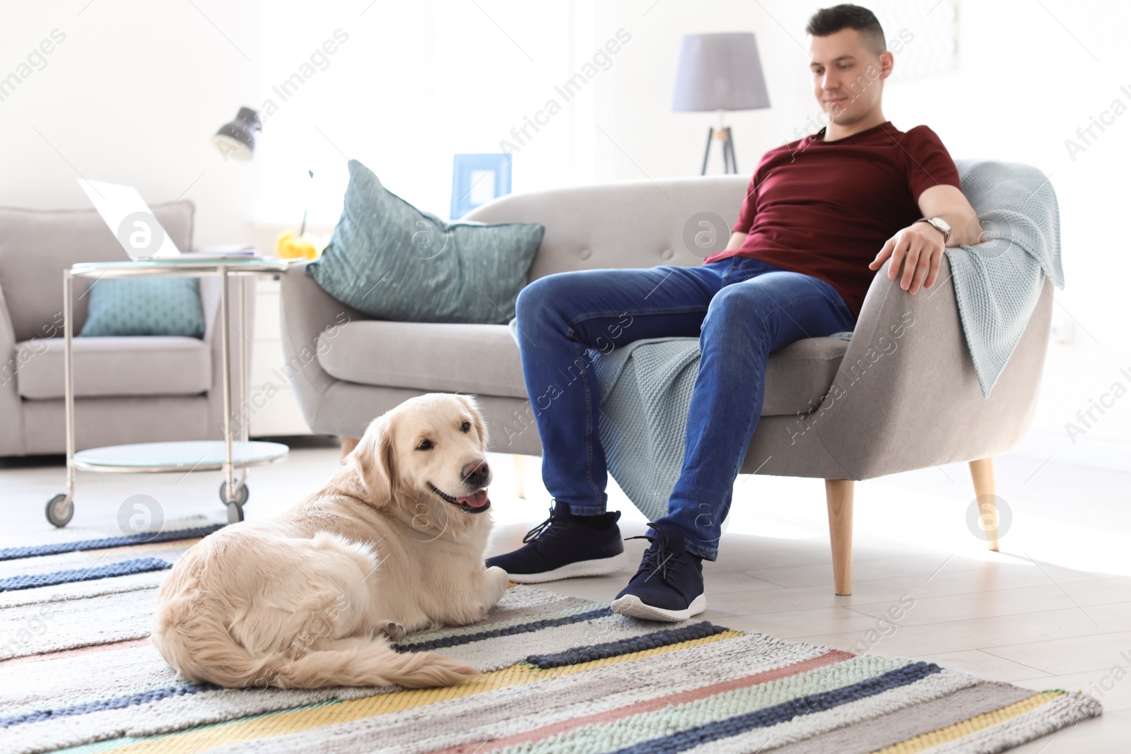 Photo of Portrait of owner with his friendly dog at home