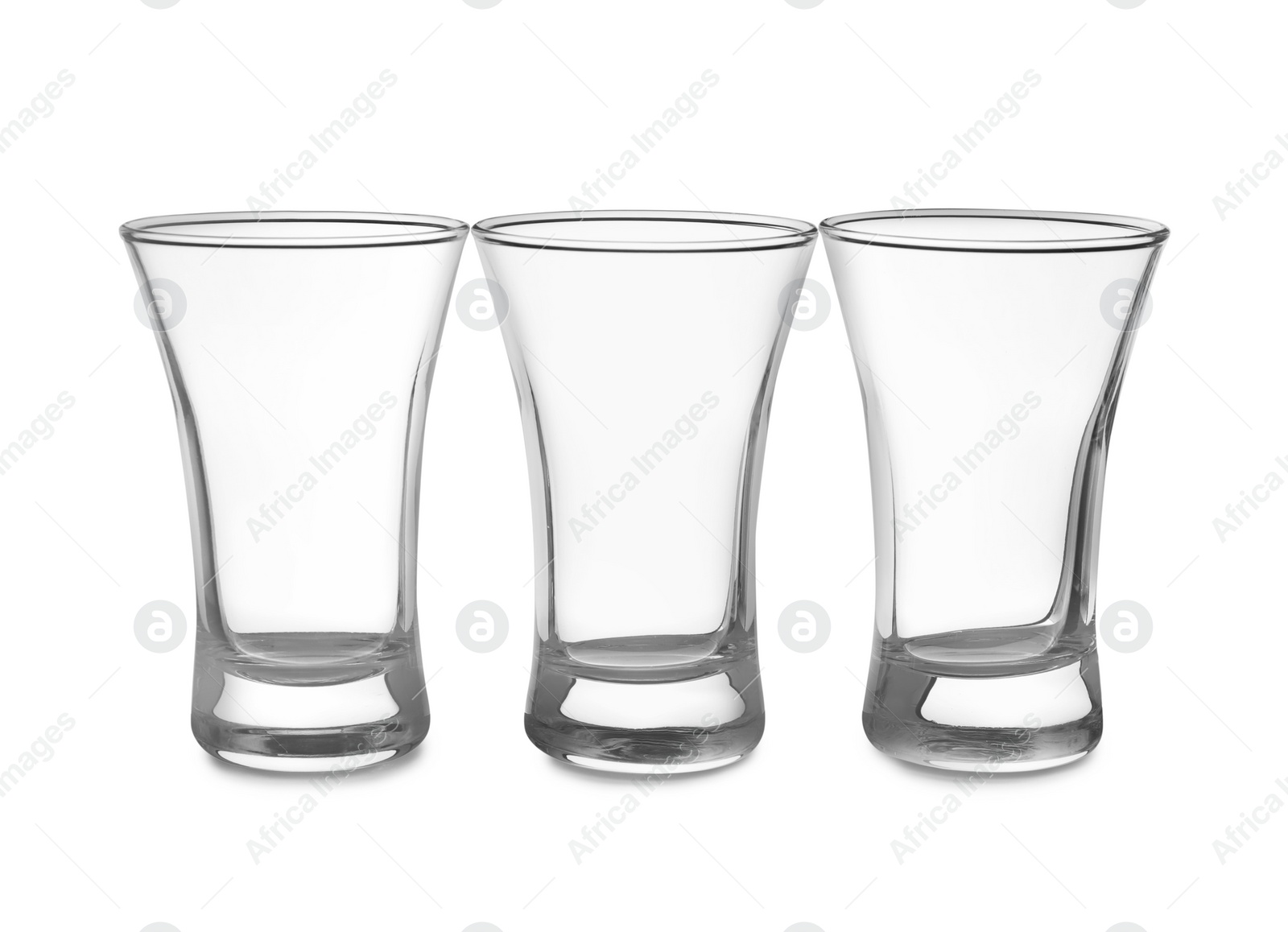 Photo of Empty clean shot glasses isolated on white