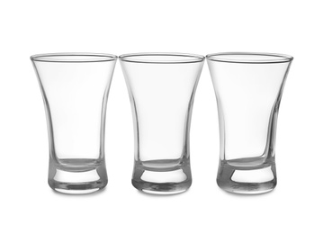 Empty clean shot glasses isolated on white