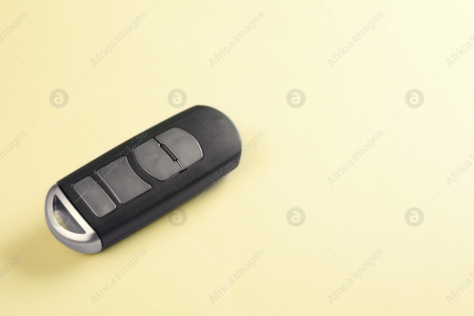 Photo of Car smart key on color background. Space for text