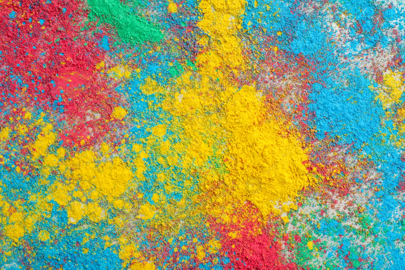 Photo of Colorful powder dyes as background, top view. Holi festival