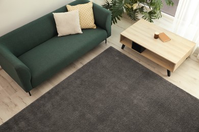 Photo of Living room interior with soft grey carpet and modern furniture, above view