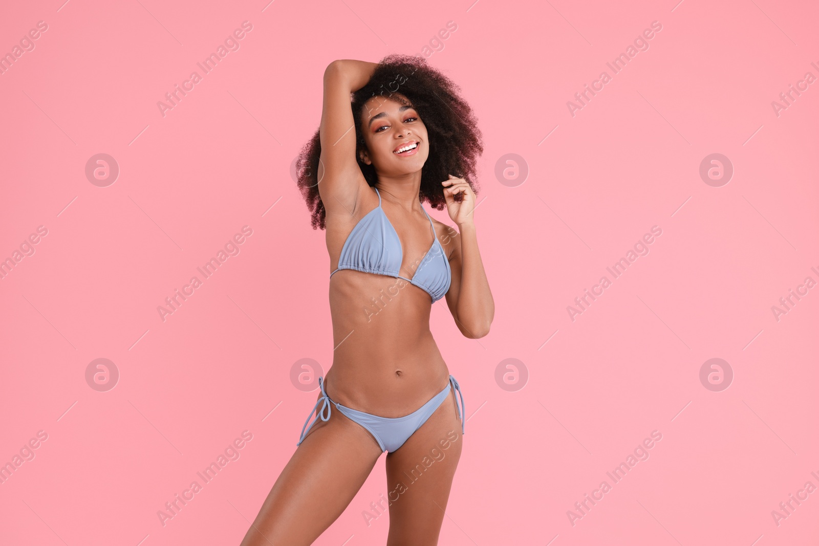 Photo of Beautiful woman in stylish bikini on pink background