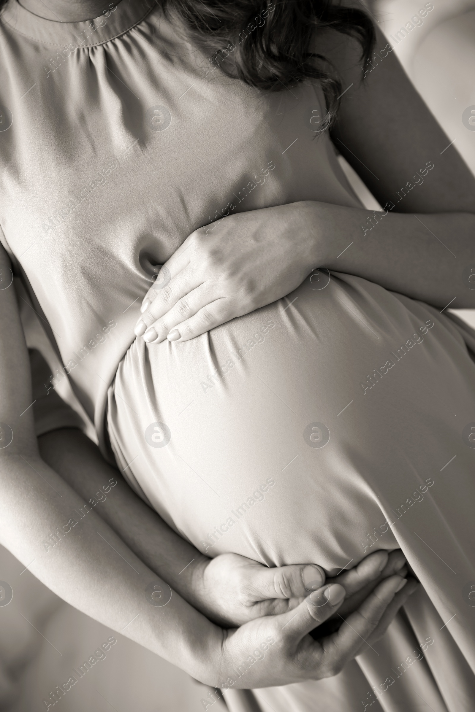 Photo of Pregnant woman with her husband, closeup. Black and white effect