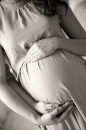 Photo of Pregnant woman with her husband, closeup. Black and white effect