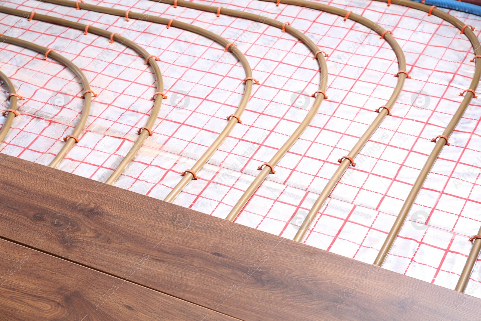 Photo of Installing new wooden laminate over underfloor heating system