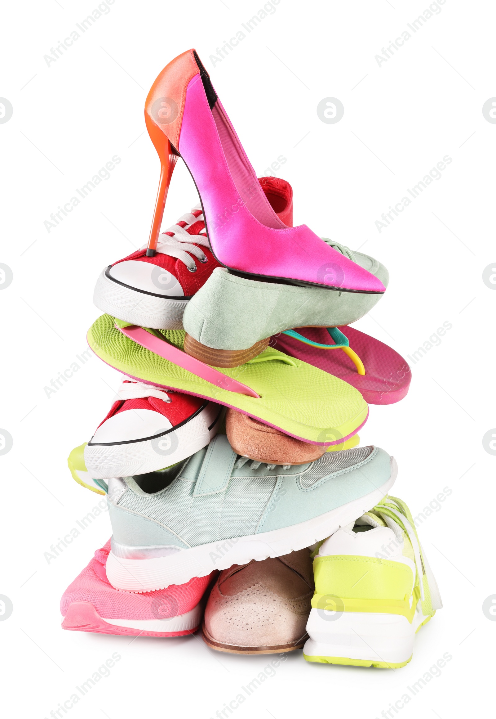 Photo of Stack of various female shoes isolated on white