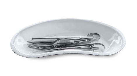 Photo of Surgical instruments in kidney dish on white background