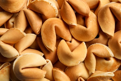 Photo of Traditional fortune cookies as background, closeup view