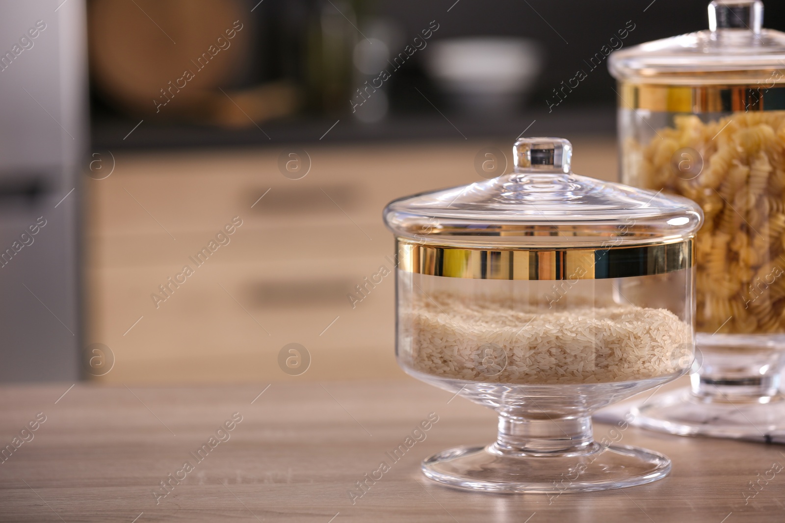 Photo of Raw foodstuff on wooden table in modern kitchen