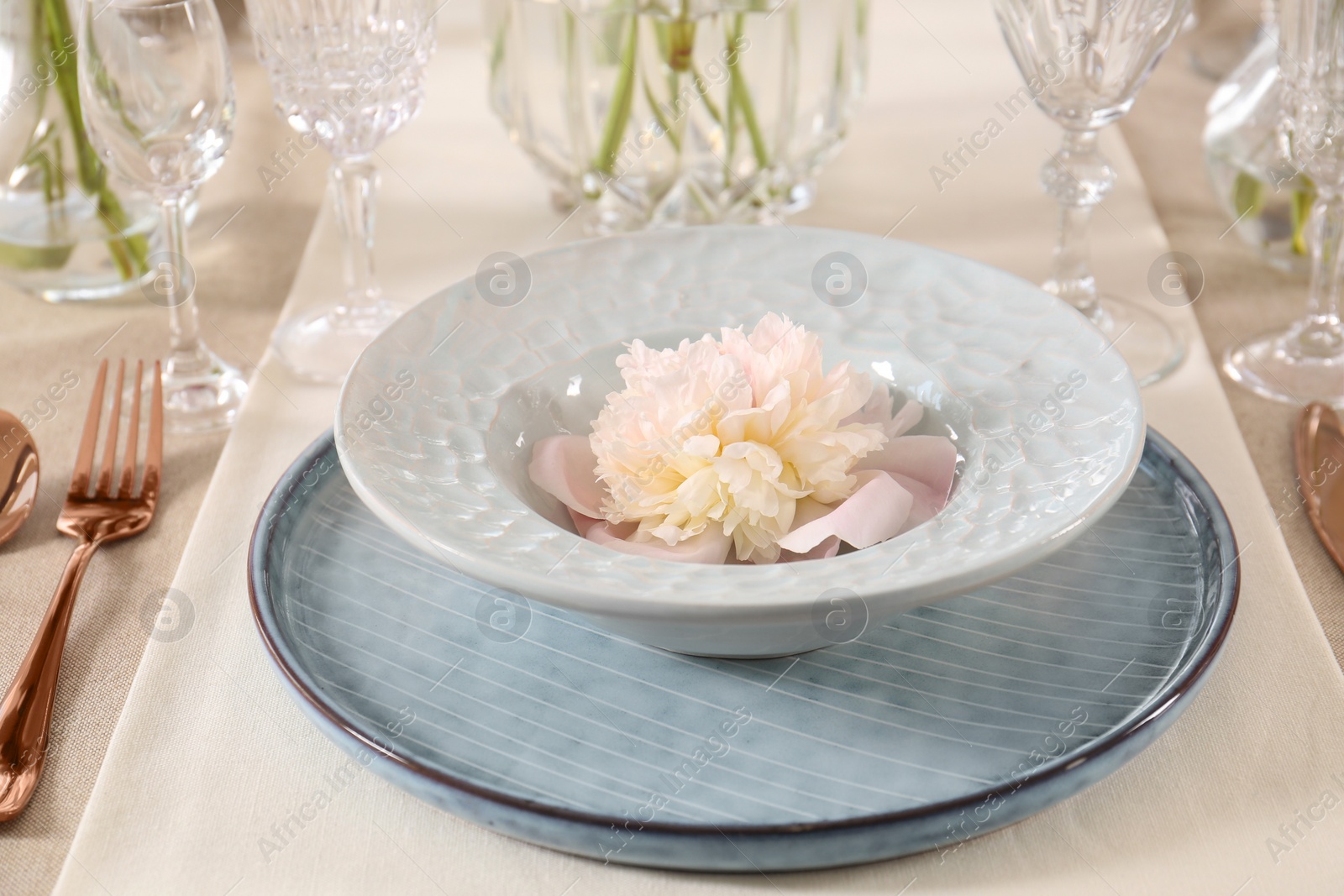 Photo of Stylish table setting with beautiful peony, closeup