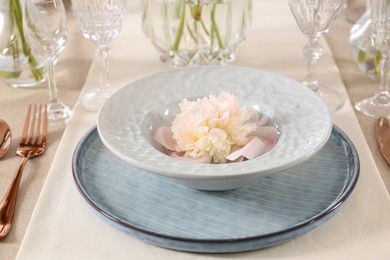 Photo of Stylish table setting with beautiful peony, closeup