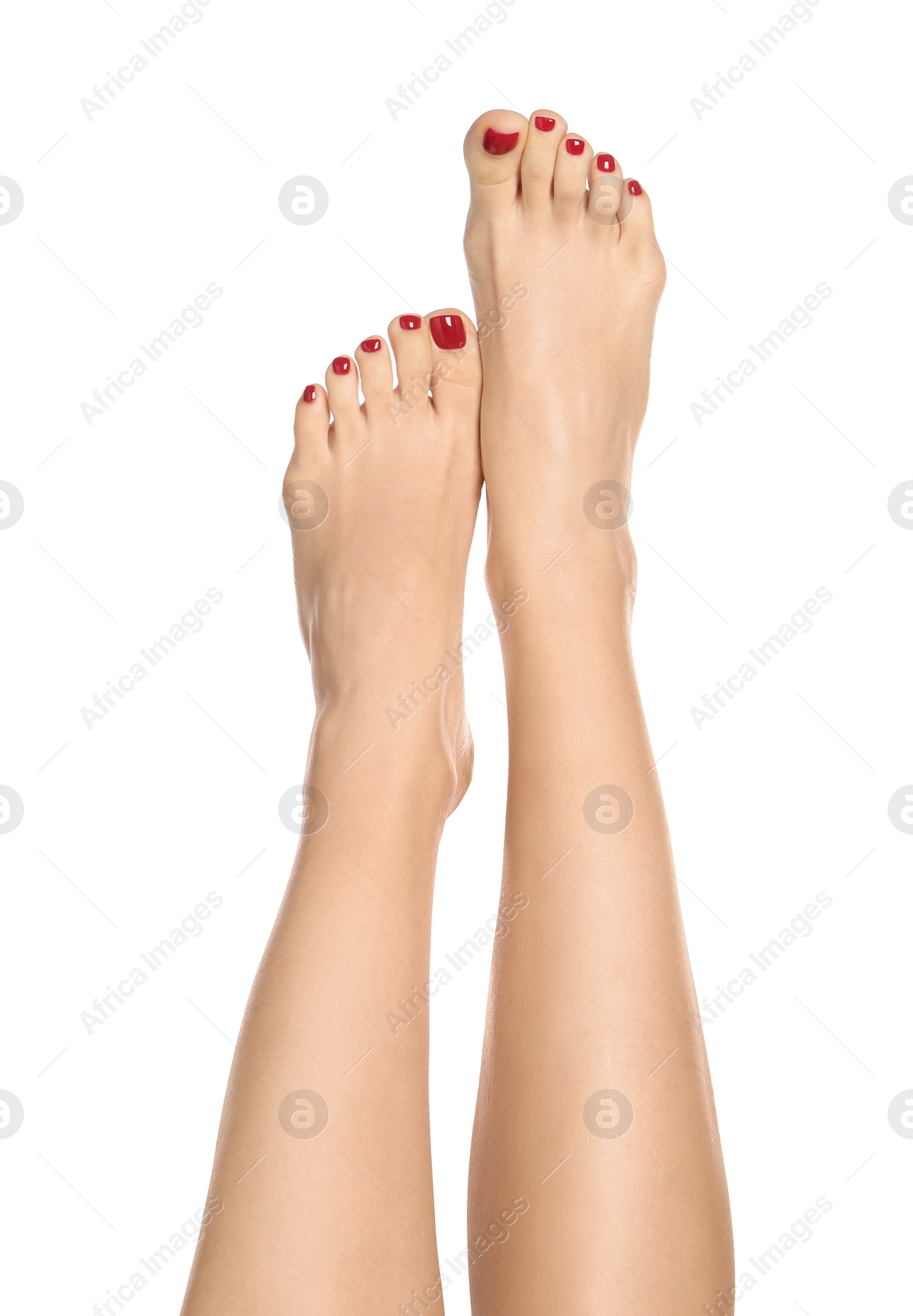 Photo of Woman with stylish red toenails after pedicure procedure isolated on white, closeup