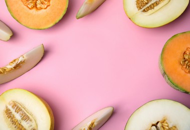 Tasty colorful ripe melons on pink background, flat lay. Space for text