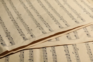 Photo of Many old note sheets as background, closeup