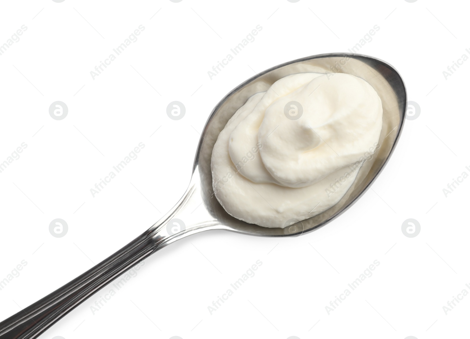 Photo of Sour cream in spoon isolated on white, top view