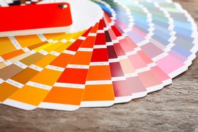 Photo of Color palette samples on wooden table