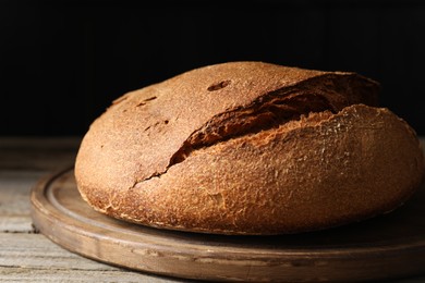 Freshly baked sourdough bread on wooden table