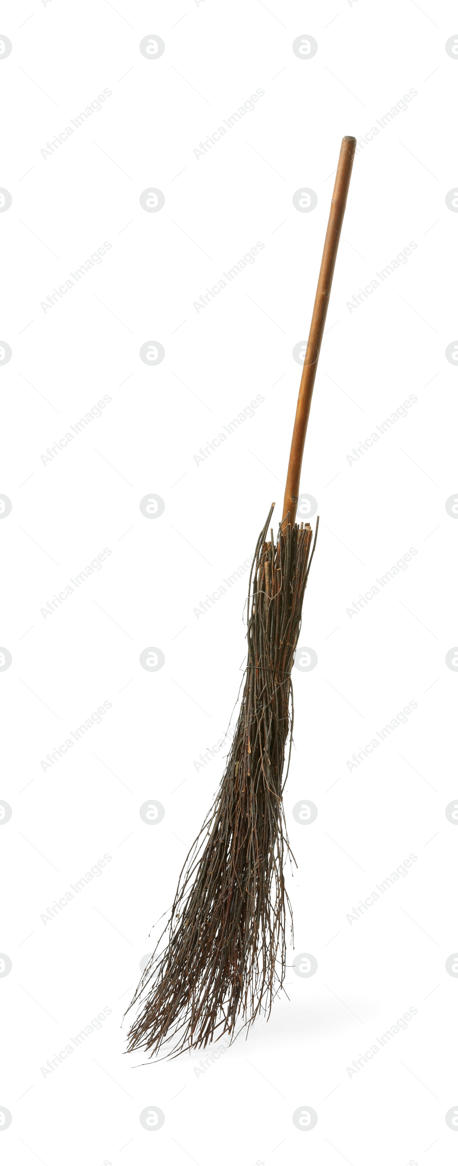 Photo of Old broom with wooden handle isolated on white