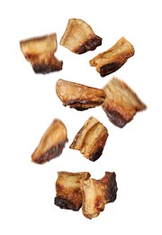 Image of Tasty fried pork lard falling on white background 