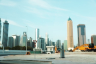 Photo of DUBAI, UNITED ARAB EMIRATES - NOVEMBER 03, 2018: Landscape with modern hotels on sunny day, blurred view