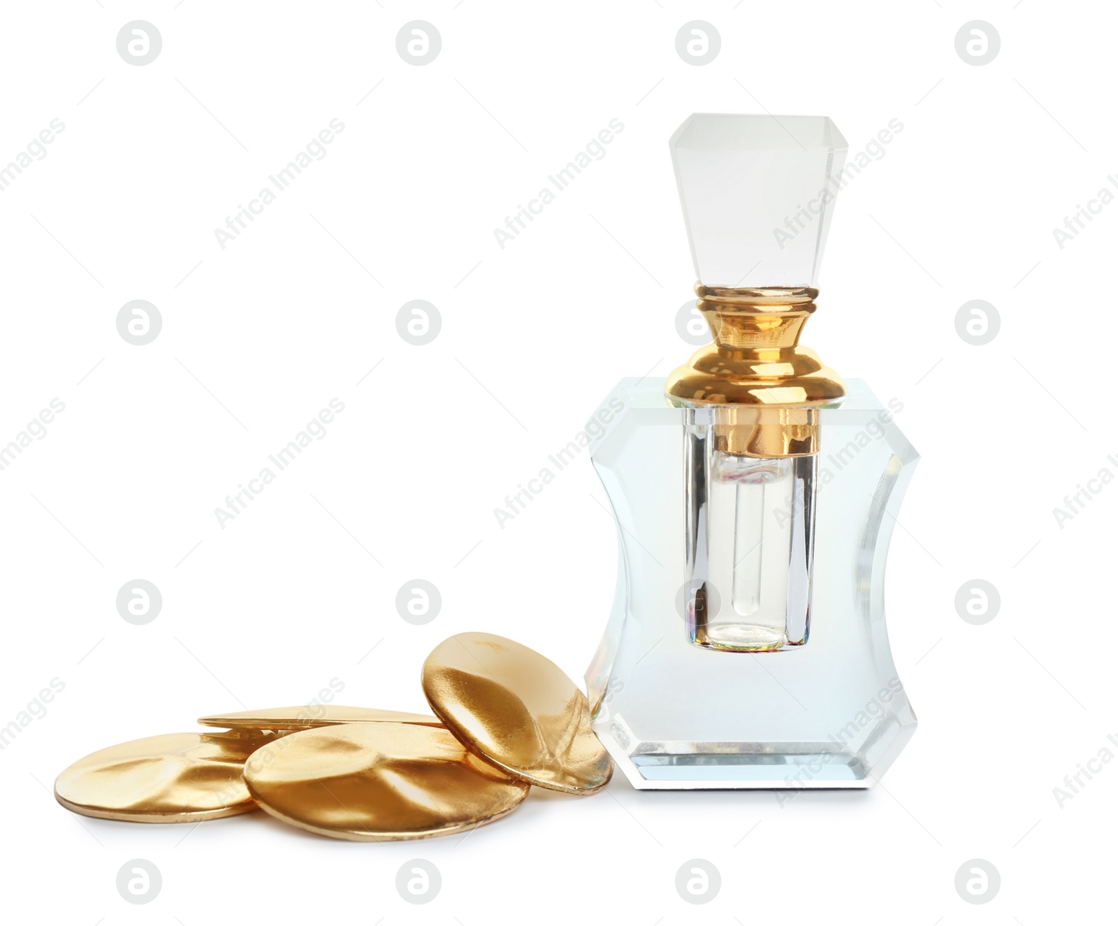 Photo of Glass bottle of perfume and luxury jewellery isolated on white