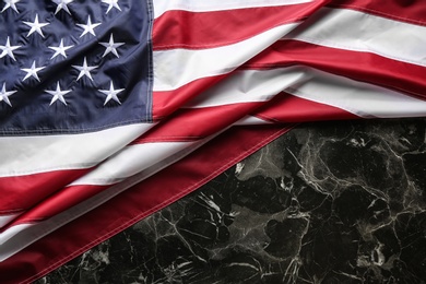 American flag on marble background, top view. Space for text