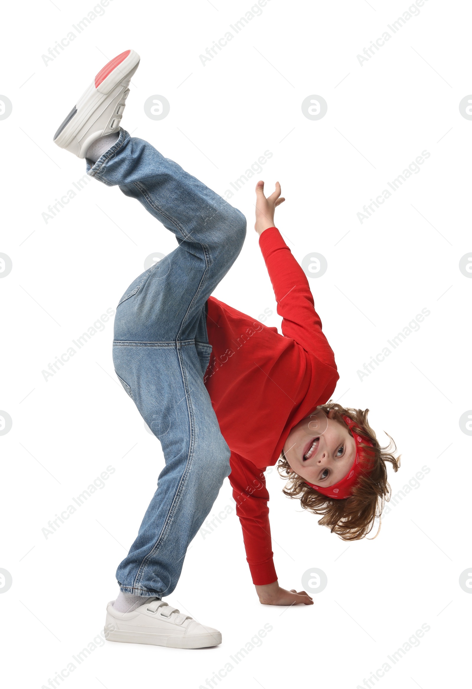 Photo of Happy little boy dancing on white background