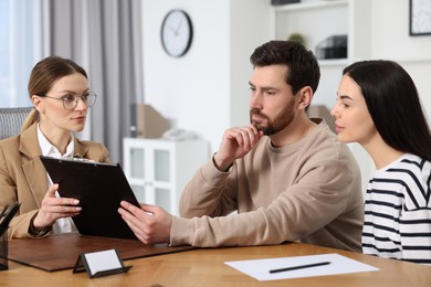 Couple having meeting with lawyer in office