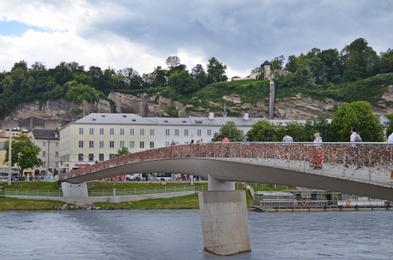 Photo of SALZBURG, AUSTRIA - JUNE 22, 2018: Picturesque view of Makartsteg bridge with colorful love locks