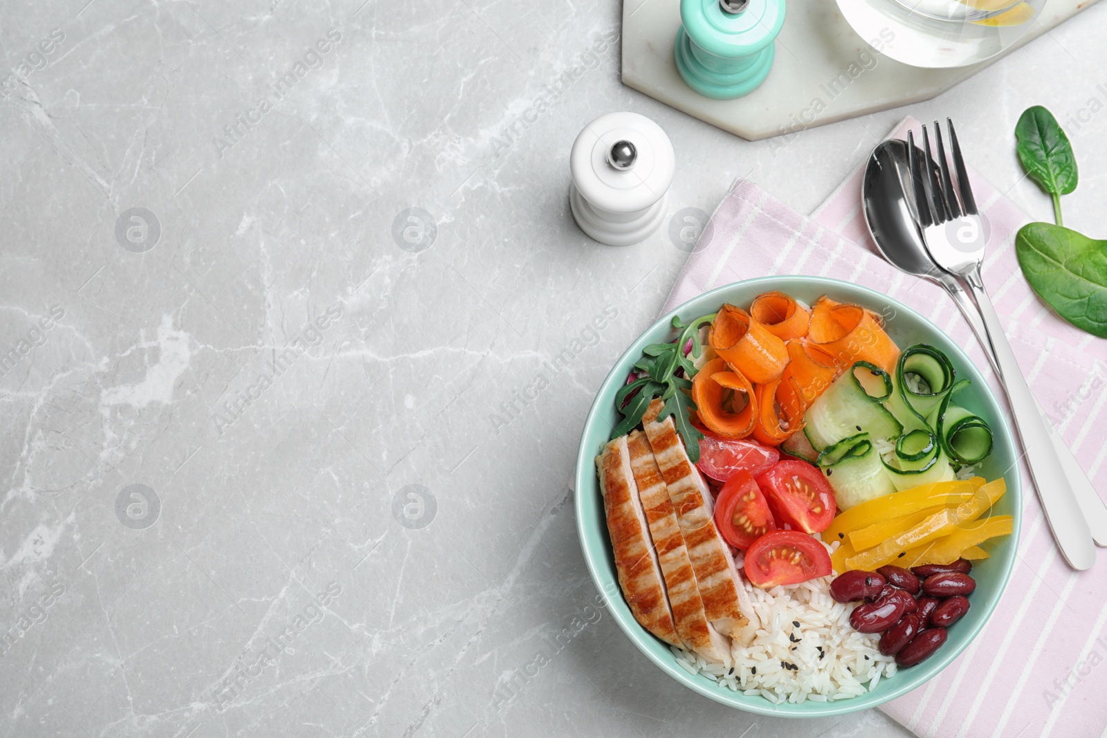 Photo of Tasty rice with beans served on light grey marble table, flat lay. Space for text