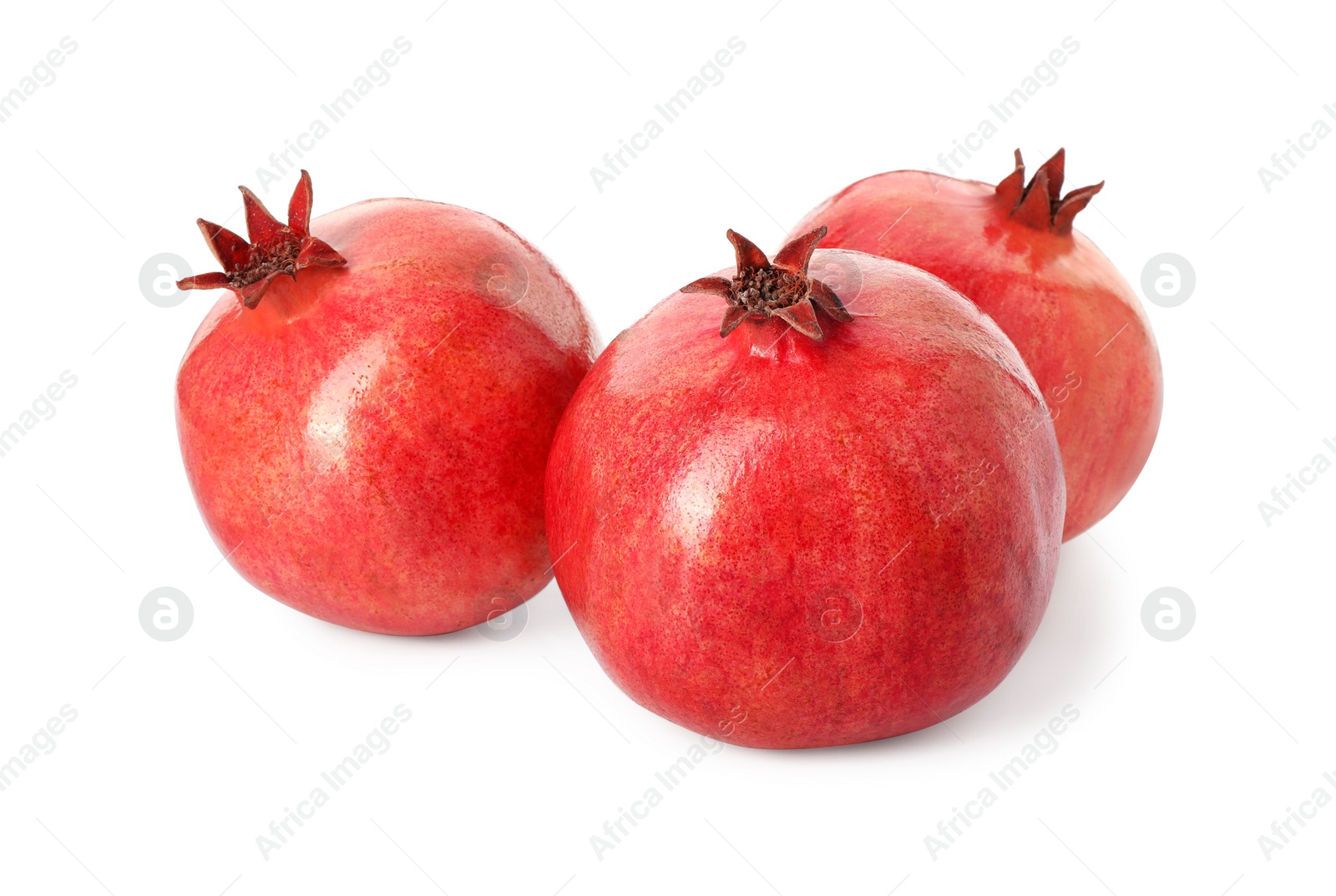 Photo of Many fresh ripe pomegranates isolated on white