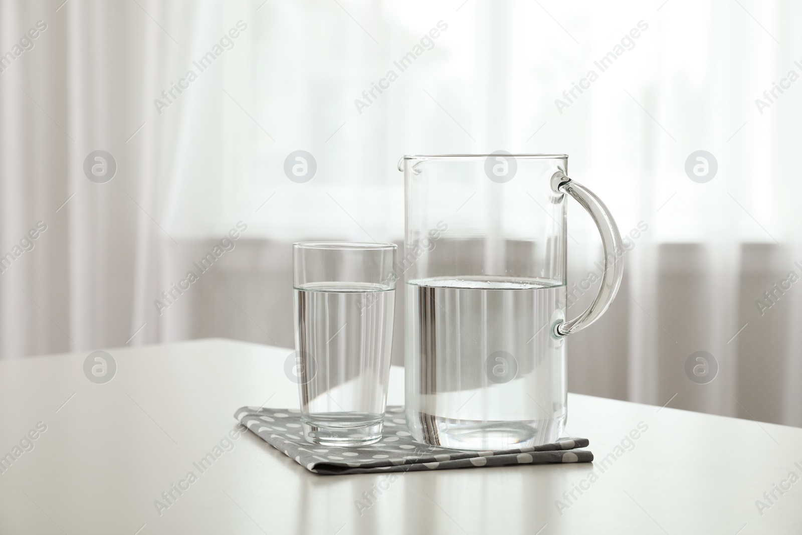 Photo of Glassware of fresh water on table indoors
