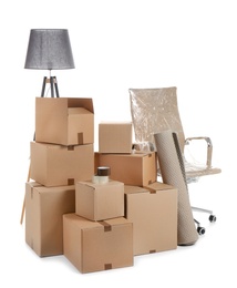 Photo of Cardboard boxes and household stuff on white background. Moving day