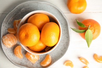 Photo of Flat lay composition with ripe tangerines on white wooden background