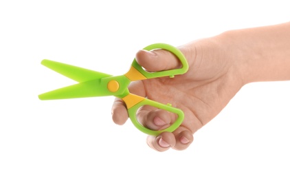 Photo of Woman holding colorful plastic scissors on white background, closeup