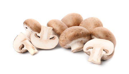 Photo of Fresh raw champignon mushrooms on white background