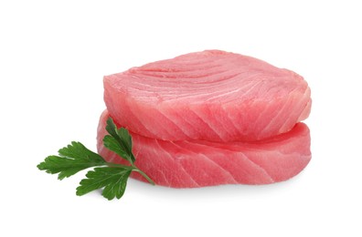 Photo of Fresh raw tuna fillets with parsley on white background