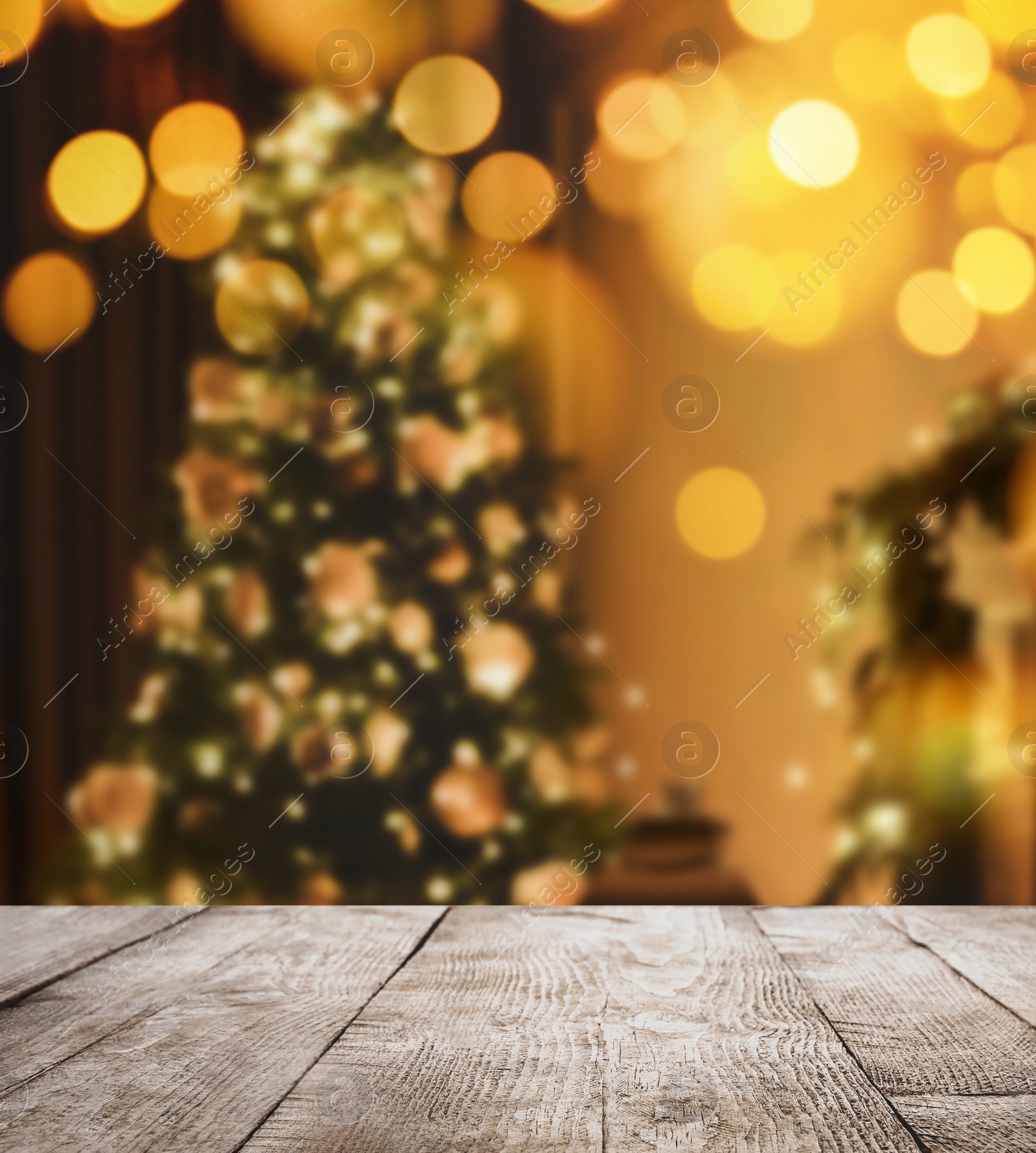 Image of Empty wooden surface and blurred view of Christmas tree in room, space for text. Interior design