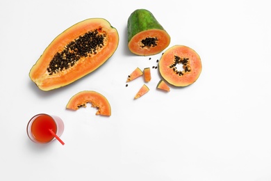 Photo of Composition with fresh cut papaya and juice on white background, top view