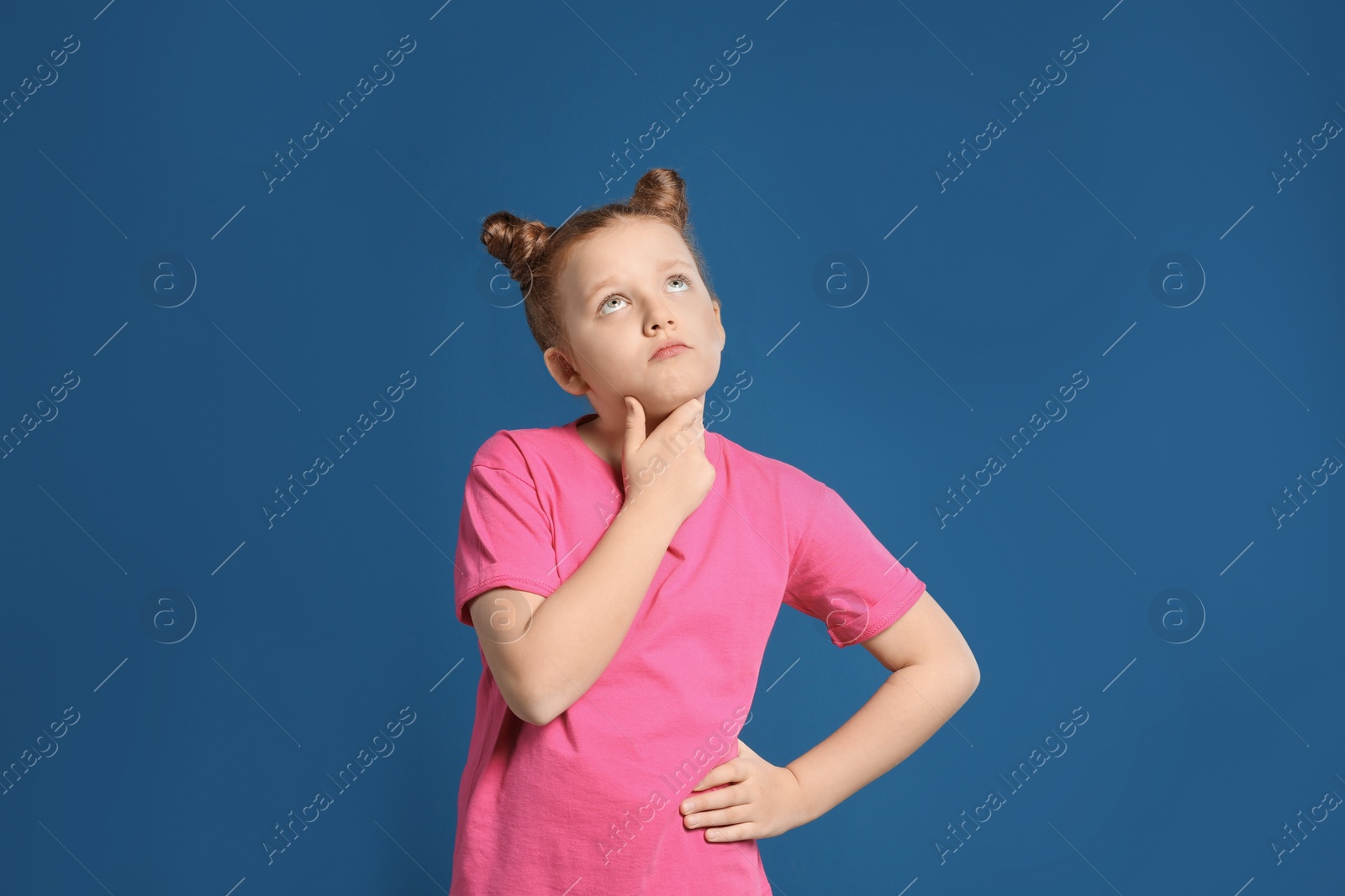 Photo of Portrait of emotional girl on blue background