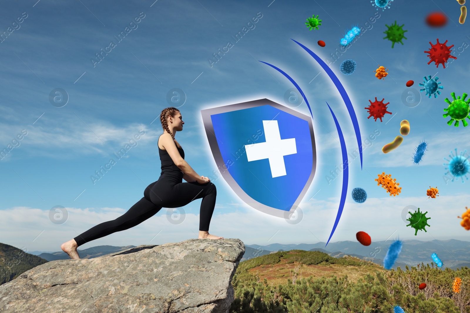 Image of Woman practicing yoga on rock in mountains. Strong immunity - shield against viruses