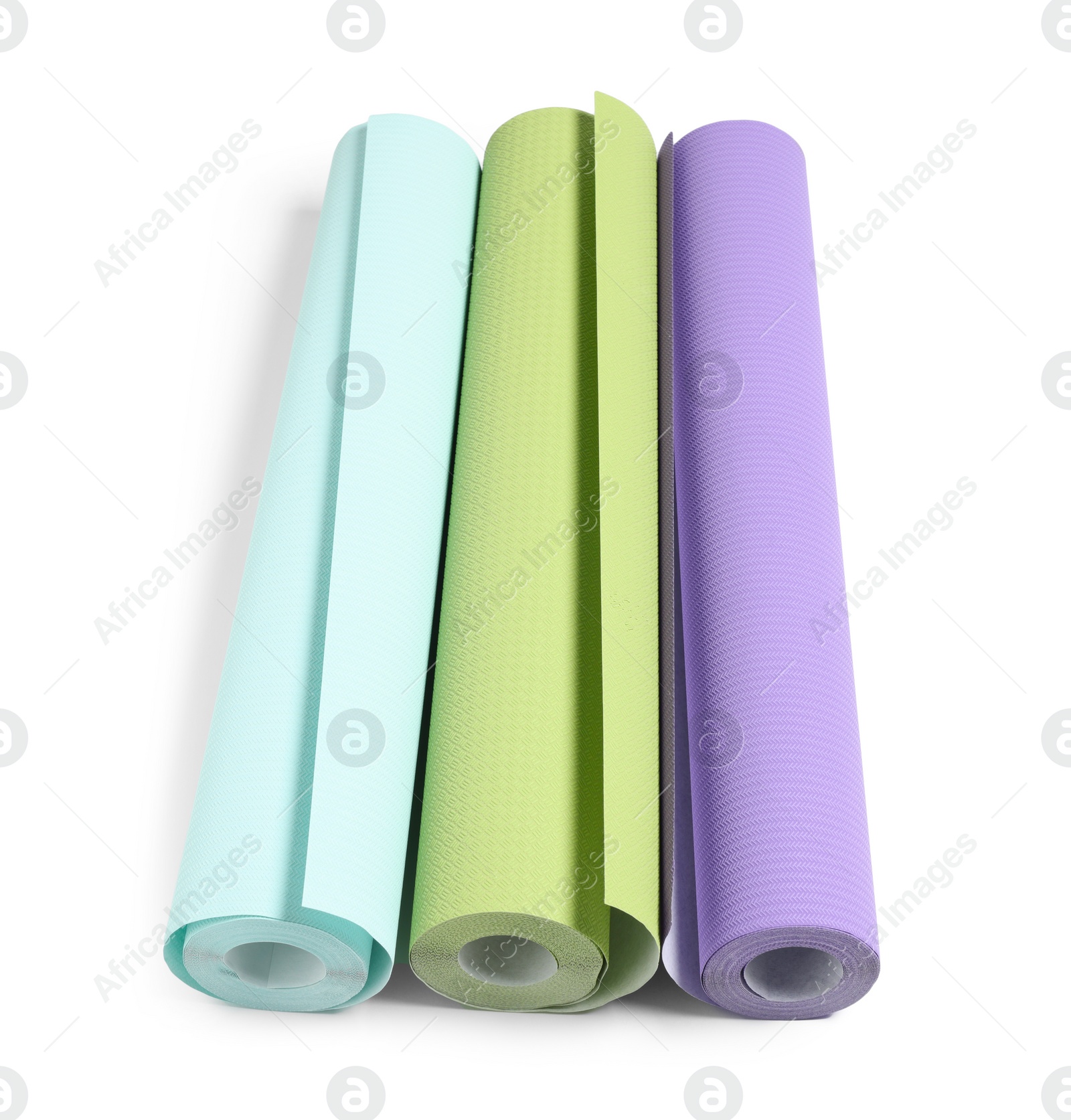 Photo of Three colorful wallpaper rolls isolated on white