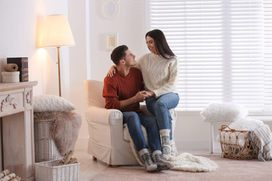 Happy couple spending time together at home. Winter vacation