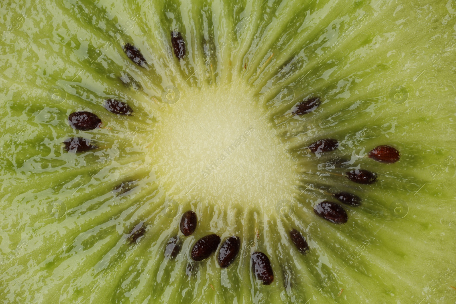 Photo of Tasty kiwi with seeds as background, macro