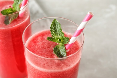 Tasty summer watermelon drink with mint in glass, closeup