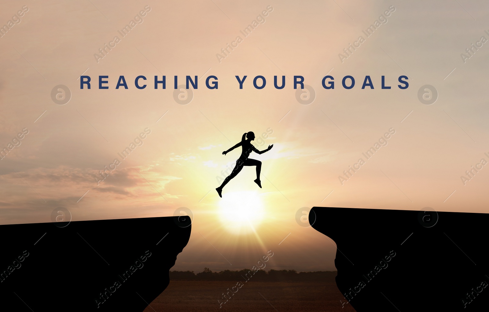 Image of Concept of reaching life and business goals. Silhouette of woman jumping over chasm at sunrise