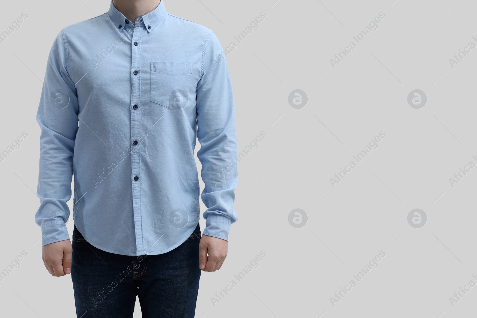 Photo of Man wearing clean shirt on white background, closeup. Space for text