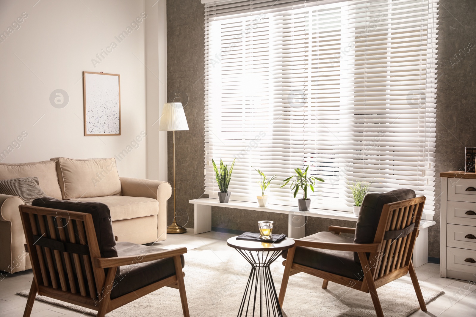 Photo of Living room interior with comfortable sofa and armchairs