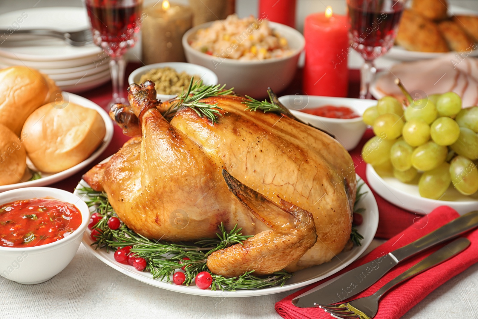 Photo of Traditional festive dinner with delicious roasted turkey served on table